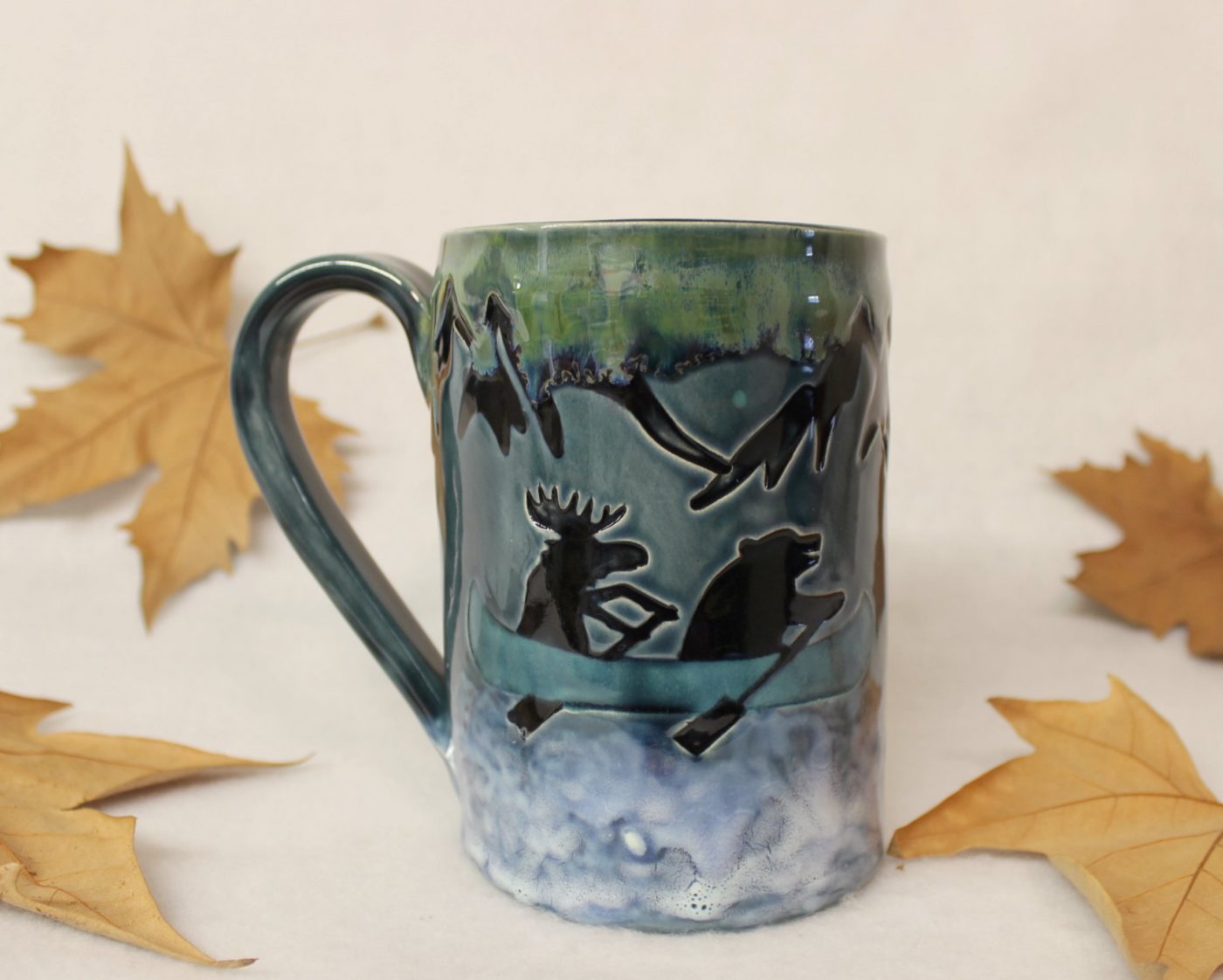 Bear and Moose in a Blue Canoe on a Mountain River Ceramic Mug - Image 2