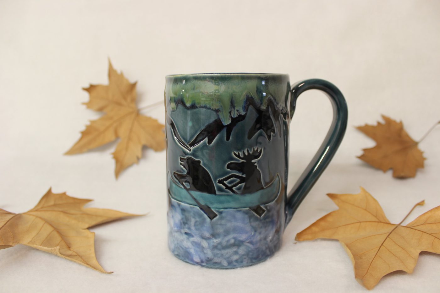 Bear and Moose in a Blue Canoe on a Mountain River Ceramic Mug - Image 4